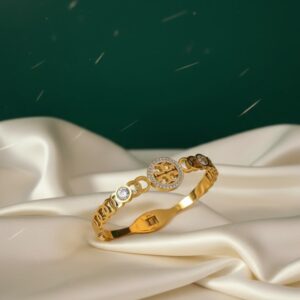 The Golden T-Emblem Crystal Cuff